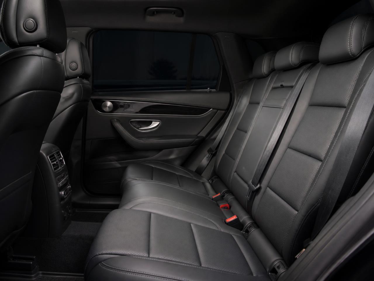 Clean black leather passenger seating with tinted privacy windows